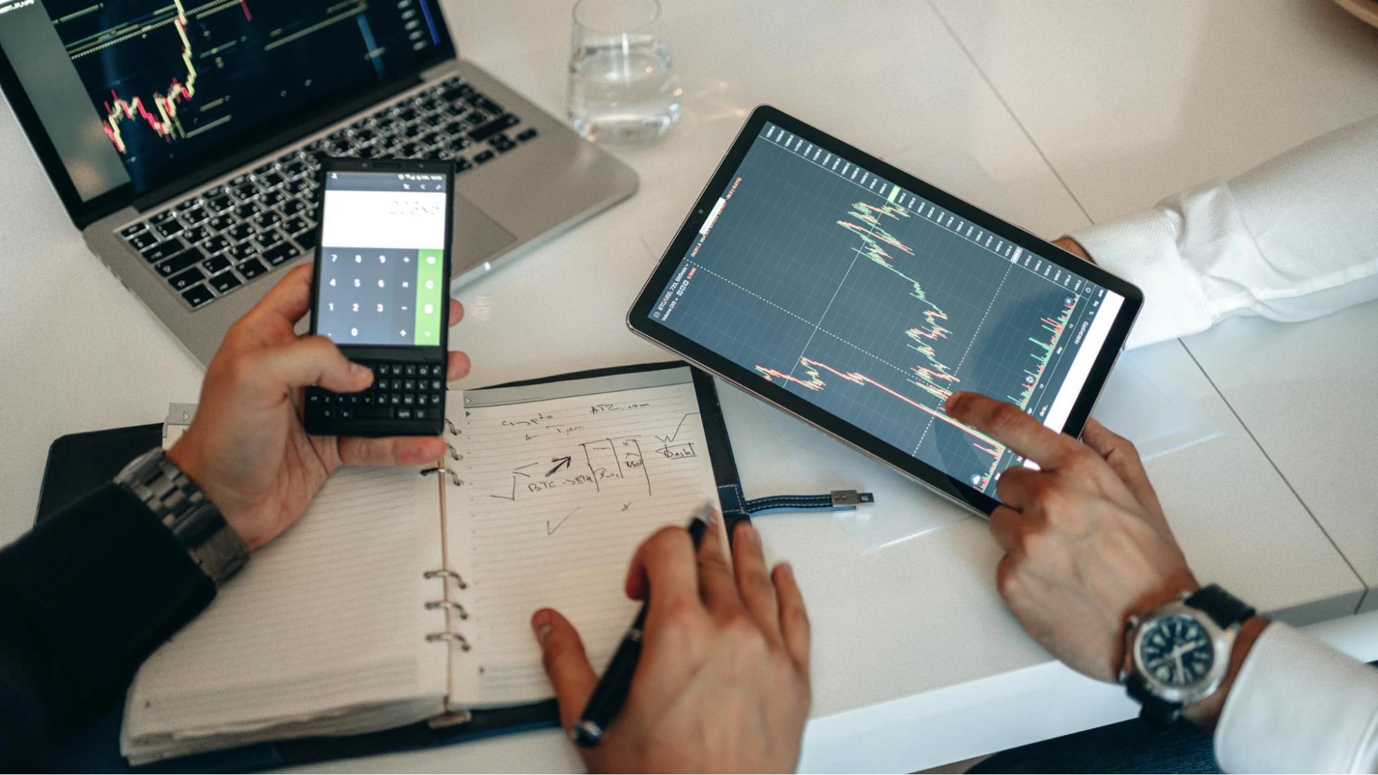 Close-up of Hands Using Smartphone to Analyze Stock Market Data